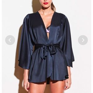Angel Sleeve Robe. Wraps across the body and is secured by a sash. Classic.